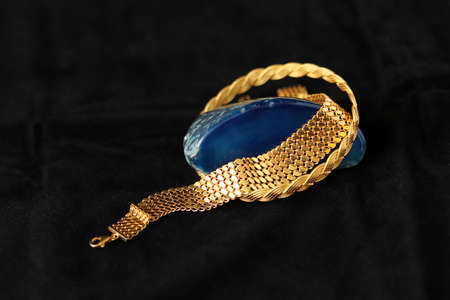 blue agate stone and gold braceletsの写真素材