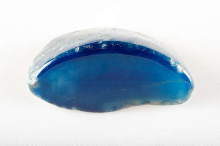 Polished Agate gemstone on white background.