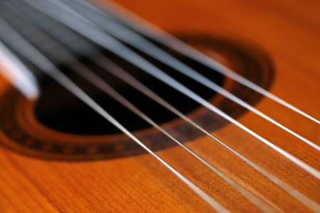 close-up natural wood acoustic guitarの写真素材