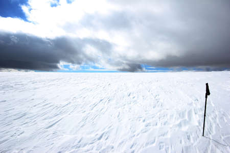 Baton and snow covered mountain