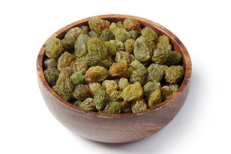 Dried green grapes in bamboo bowlの写真素材