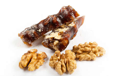 Walnuts on a string dipped in starch grape molasses. churchchela walnut sujukの写真素材