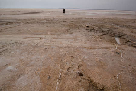 Man walking by the salt lakeの写真素材