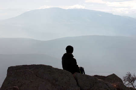 watching nature on the rockの写真素材