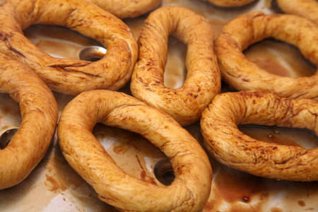 Making Turkish sesame bagels. Simit