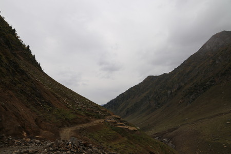 Amazing view of big mountains under dark cloudsの写真素材