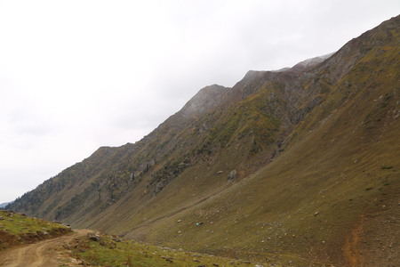 Mountains in kashmir under cloudy skyの写真素材
