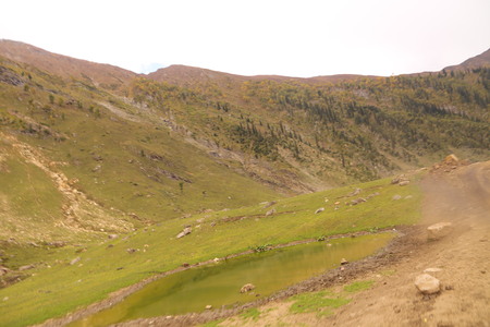 Track passing through between the big mountainの写真素材