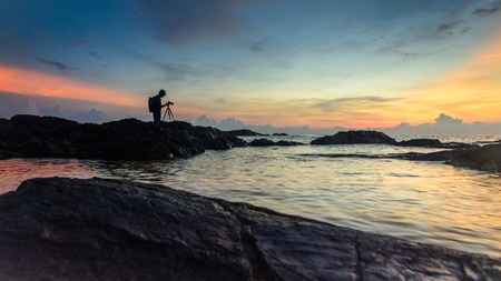Scenery of sunrise with silhouette of photographer at Dungun, Terengganuの素材