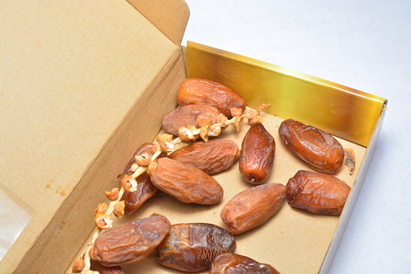 fresh dates palm isolated in box