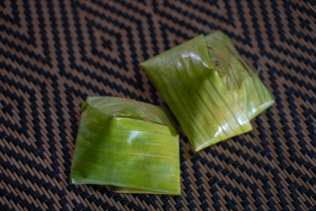 Nasi lemak is a Malay fragrant rice dish cooked in coconut milk and pandan or banana leaf. It is common food found in Malaysia.の写真素材