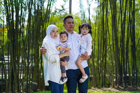 Happy family, spending time together, playing at park. Parenting, happy family concept. Selective focusの写真素材