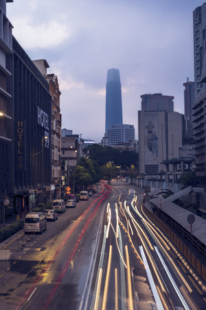 Kuala Lumpur, Malaysia - April 12th, 2019 : Pudu Sentral downtown overlooking Tun Razak Exchange (TRX) tower with light trails during sunrise. The Pudu Sentral is the main local service bus terminus.のeditorial素材