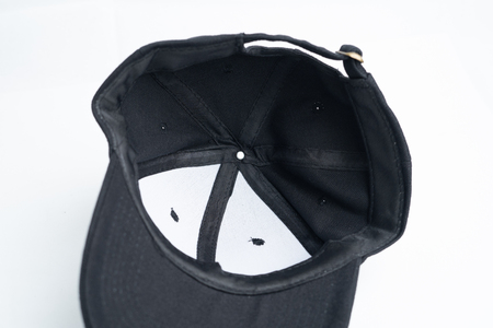 Close up black cap, or snapback isolated on white background.