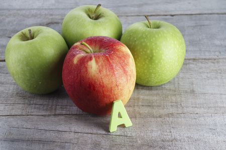 Red and green apple with letter Aの写真素材
