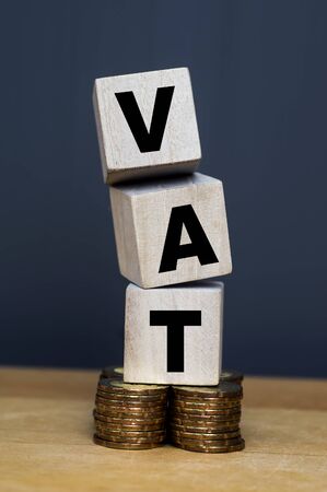 VAT Concept. Word VAT with stacked coinsの写真素材