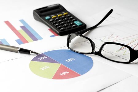 Business Analysis report with graph chart, glass and calculator for annual reportの写真素材