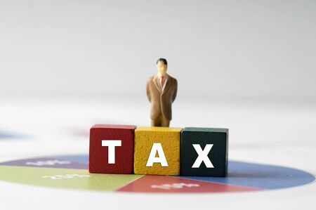 Tax Concept with tax word on wooden blockの写真素材