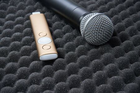 radio microphone and presenter for speech. Item stand on foam rubber. Public presentation concept. Corporate training communication at professional. Universal style education, conference, congress.の写真素材