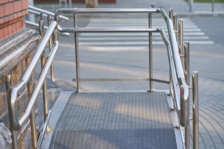 Ramp way with stainless steel handrail with for support wheelchair disabled people. accessibility architecture fo low mobile people.の写真素材