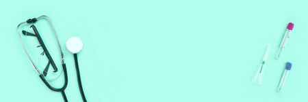 stethoscope and eyeglass lying on a green background. The concept of medical equipment instrument.の写真素材