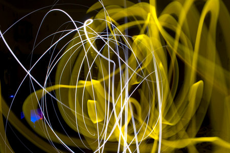 abstract light trails on a black background, closeup of photoの写真素材