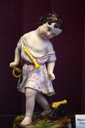 Sculpture of a little girl in a beautiful dress.の写真素材