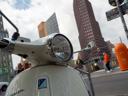 BERLIN, GERMANY - May 21, 2022; Scooter on the background of skyscrapers. vintage moped. Podzdam Square. May 21, 2022 Berlin Germanyのeditorial素材