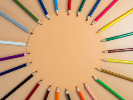 Education and back to school concept. Colored pencils on an orange background.の写真素材