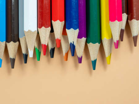 Education and back to school concept. Colored pencils on an orange background.の写真素材