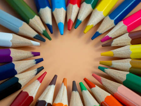 Education and back to school concept. Colored pencils on an orange background.の写真素材