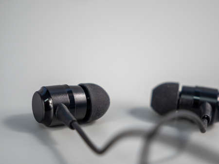 Black headphones on a gray background. Close up.の写真素材