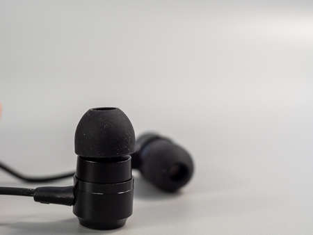 Black headphones on a gray background. Close up.の写真素材