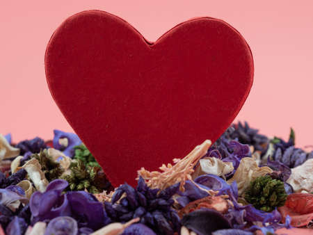 Heart shaped boxes and flower confetti or potpourri on a pink background. Hearts on a pink background.の写真素材