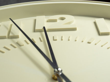 Wall clock on a gray background. Clock close up. Watch face with large numbers.