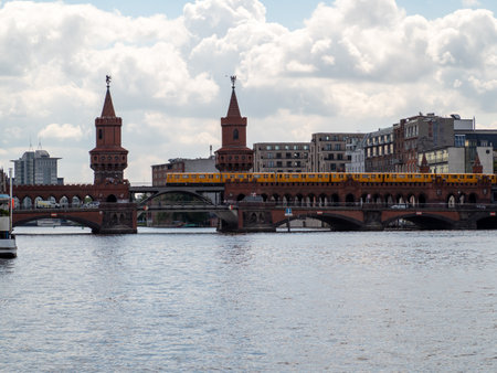 Yellow train in Berlin. Train at the station. Yellow train on the Oberbaum Bridge in Berlin, Germanyのeditorial素材