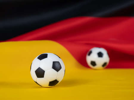 Soccer ball on the German flag. The ball against the background of the German flag. German football league concept.の写真素材