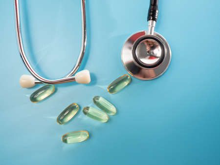 Medical stethoscope and medicines. Stethoscope and medicines close-up.の写真素材
