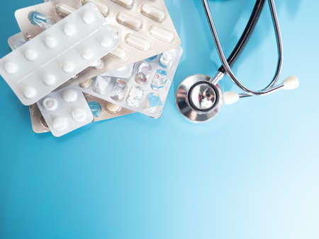 Medical stethoscope and medicines. Stethoscope and medicines close-up.の写真素材