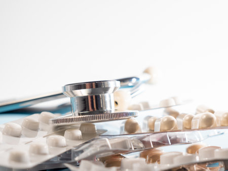 Medical stethoscope and medicines. Stethoscope and medicines close-up.の写真素材