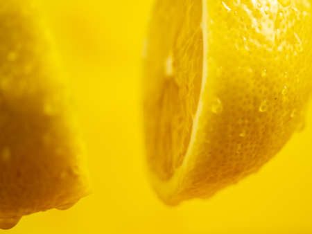 Cut the lemon with a knife in the air. Cut a lemon with a knife.の写真素材