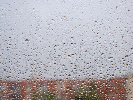 Raindrops on the window glass. Current raindrops. Bad weather.の写真素材