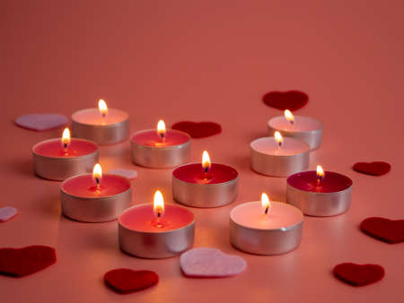 Pink candles on a pink background. Close up. Love concept.の写真素材