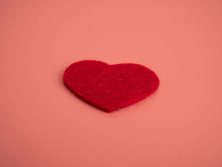 Red heart on a pink background. Close up. Love concept.の写真素材
