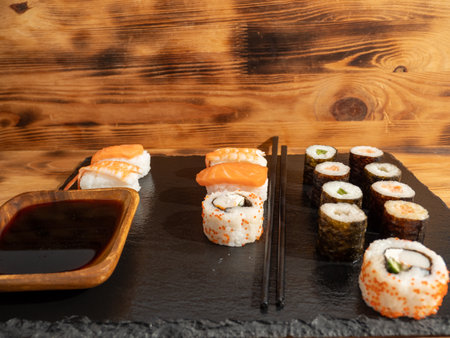 Japanese kitchen. Sushi on a dark background. Sushi closeup.の写真素材