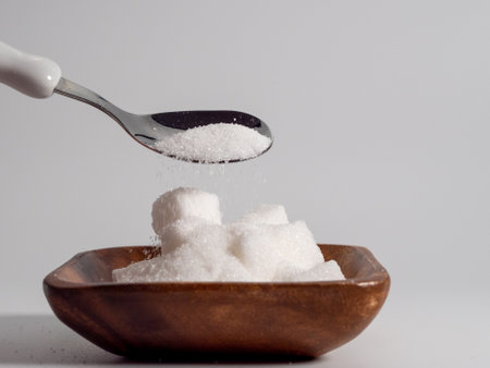 Sugar on a white background. Junk food concept. Close up.の写真素材