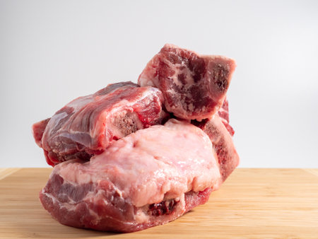 Raw meat with beef bone. Choice of beef on the bone for soups. Close up.の写真素材