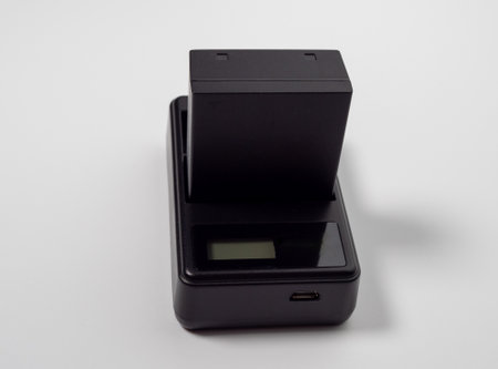Battery for the camera on a white background. Close up.