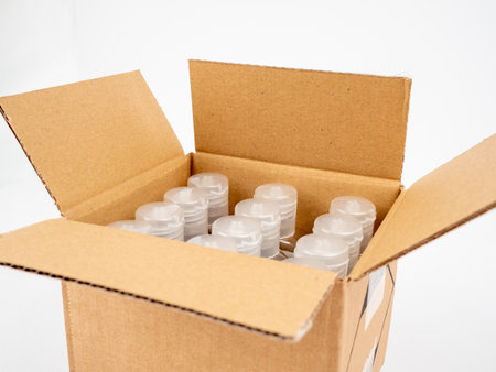 Cardboard box with goods on a white background. Open cardboard boxes. close up.の写真素材