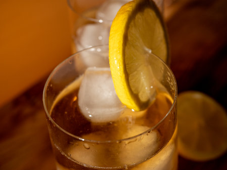 Iced tea in a glass with ice cubes. Cold tea with ice. close upの写真素材